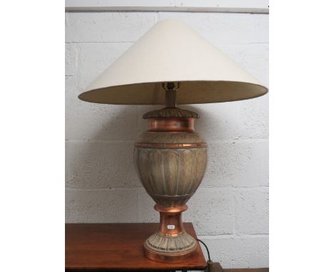 Urn style table lamp with shade. Working order in good condition.  Measures 31 inches tall. See photos      S2