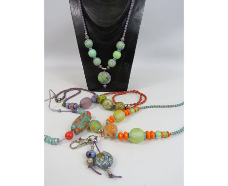 5 Artisan handmade lampwork frosted glass necklaces and a key ring. Some have sterling silver claps.