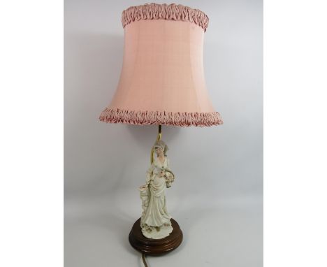 A Belcari figural table lamp.
