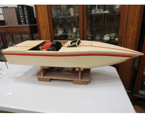 Handmade remote controlled Pond boat powered by a two stroke strimmer engine. All in working order with cradle stand. Measure