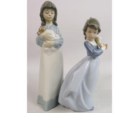 2 Nao figurines of girls one with a dog and one with flowers.