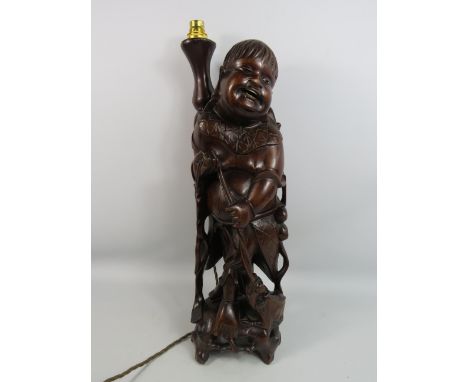 Vintage oriental carved root wooden figural lamp which stands, 22.5 inches tall.