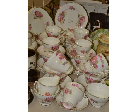 A Regency Bone China tea service, for twelve, decorated with large flower heads, printed marks