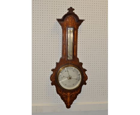A Sheraton Revival mahogany and marquetry aneroid wheel barometer, 19cm silvered register inscribed W R Lisle, Exeter, mercur