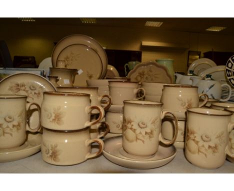 A Denby Memories pattern part dinner service, comprising of plates , bowls, cups and saucers, casserole dish; etc 