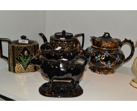 A Jackfield type teapot, others, a pair of Jackfield type cow creamers (5)