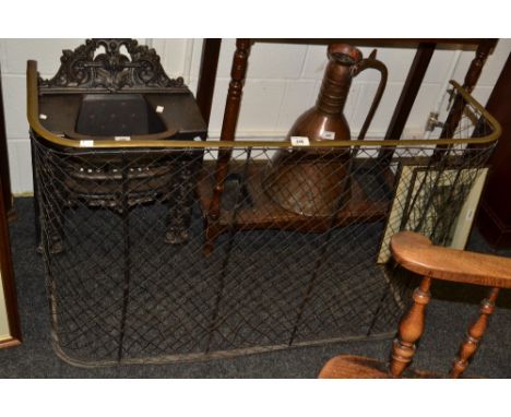 A Victorian brass and mesh high fireguard