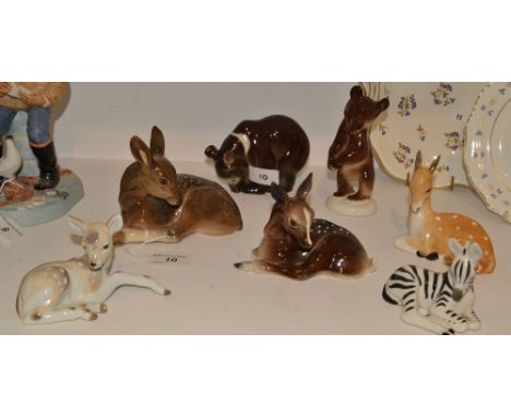 A Russian ceramic Brown Bear, a Russian ceramic Zebra, a West German model of a Fawn; etc (7)