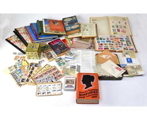 Various albums containing British and worldwide stamps, a collection of loose stamps contained within boxes, 'The World in St