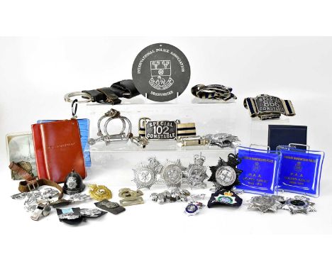 A collection of Police related memorabilia including cap badges, cloth badges, pin badges, buttons, stickers for Police Autho