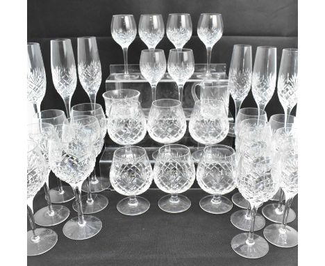 EDINBURGH CRYSTAL; thirty-three pieces of 'Lewis' pattern crystal drinking glasses, comprising five sets of six, small jug, s