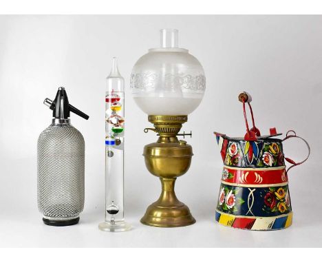 A collectors' lot comprising a bargeware cream jug, height 35cm, a soda siphon, a brass oil lamp with etched shade and a Gali
