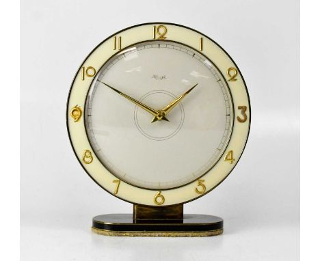 A mid-20th century Kienzle mantel clock, the ivorine chapter ring set with Arabic numerals, in black and chrome enamelled sur