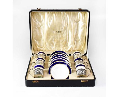AYNSLEY; a cased set of eight George VI hallmarked silver and porcelain coffee cups and six coffee cups and saucers in pierce
