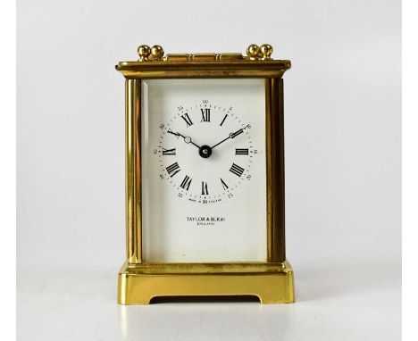 TAYLOR &amp; BLIGH; a brass cased carriage clock, the enamelled dial set with Roman and Arabic numerals, the single drum move