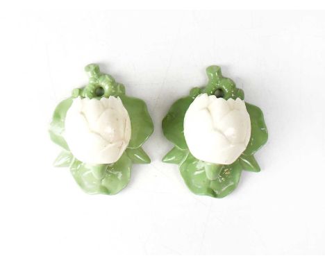 GRAINGER &amp; CO FOR ROYAL WORCESTER; a pair of wall sconces in the form of partially opened water lilies, height 12cm (2).C
