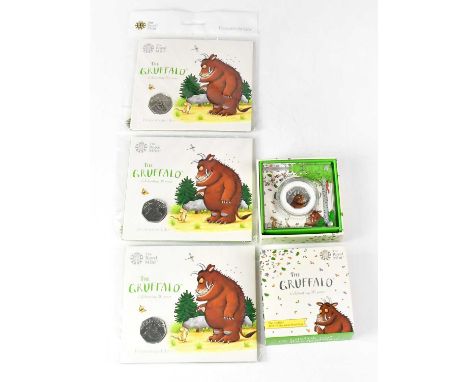 THE ROYAL MINT; four coins comprising a presented 'Celebrating 20 Years of the Gruffalo' silver proof 50p, and three 'Celebra