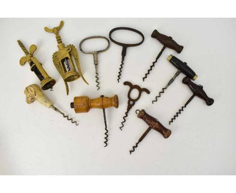 Eleven vintage and antique corkscrews including two brass screw examples, four similar with bobbin tops, two oval ring pull c