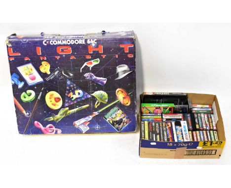 COMMODORE; a '64C Light Fantastic' games console and a quantity of Commodore 64 games in cassette tape form, including 'WWF W