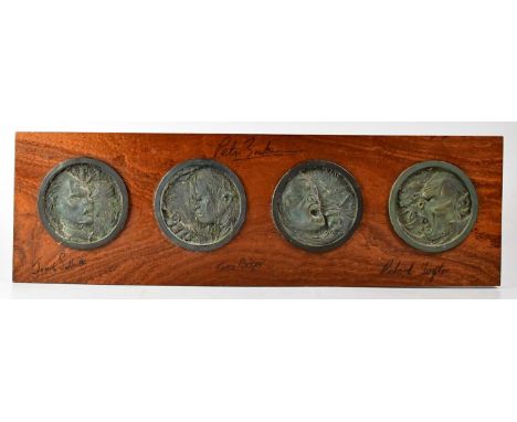 LORD OF THE RINGS; a Weta Workshop commemorative plaque of four bronzed discs with images of Orcs mounted on a board and sign