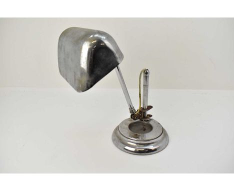 A vintage chrome plated desk lamp, with adjustable arm and shade, height when extended 47cm, on a circular steel weighted bas