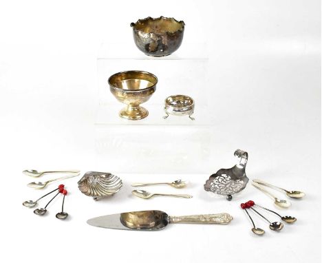 A group of hallmarked silver items, comprising a shell-shaped salt on three spherical feet, length 9.2cm, a salt on three hoo
