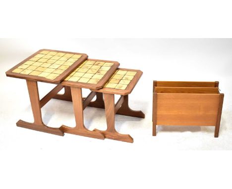 A mid-20th century teak nest of tables with tile tops, the largest 45 x 50 x 43cm, together with a teak magazine rack, height