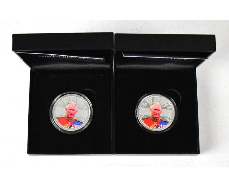 A cased pair of 'The Accession of the King', KCIII 1oz sterling silver proof coins, both with certificate of authenticity.