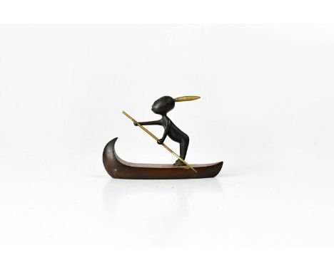 † KARL HAGENHAUER (Austrian, 1898-1956); a bronze figure of an African boy with a feather in his hair and paddle in his hand,
