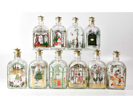 Ten Holmegaard Christmas decanters, each printed with an image and with metal stoppers, all with labels, height 19.5cm (10).C