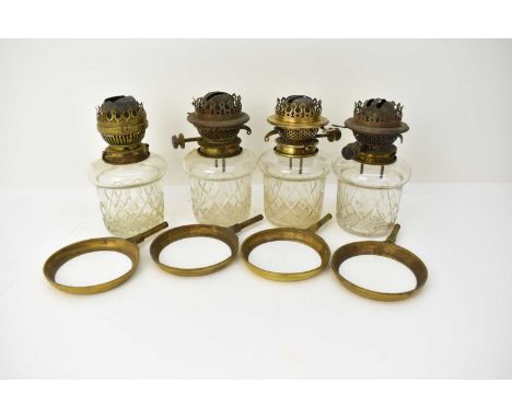 BINKS &amp; SON LTD; a set of four late 19th/early 20th century paraffin lamp fonts and burners, height 21cm, with four holdi