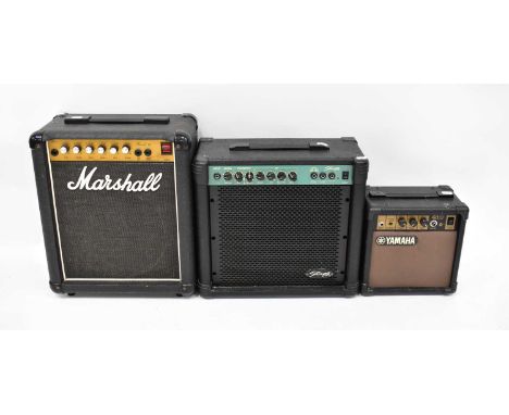 Three amplifiers comprising a Marshall Revert 12, a Stagg 20GA, and a Yamaha GA-10 together with a large tambourine with a St