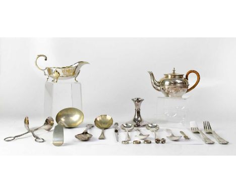 A group of silver plated items, to include a ladle, sauce boat, spoons, forks, tongs, paper knife, berry spoon, and a teapot,