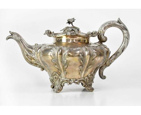 CHARLES REILY &amp; GEORGE STORER; a George IV hallmarked silver teapot of squat circular form, decorated with acanthus leave