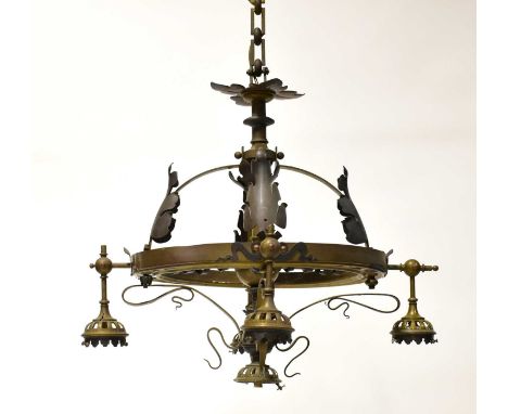 A brass light fitting, with central ring supporting four branches with applied cast metal decoration, with downward facing li
