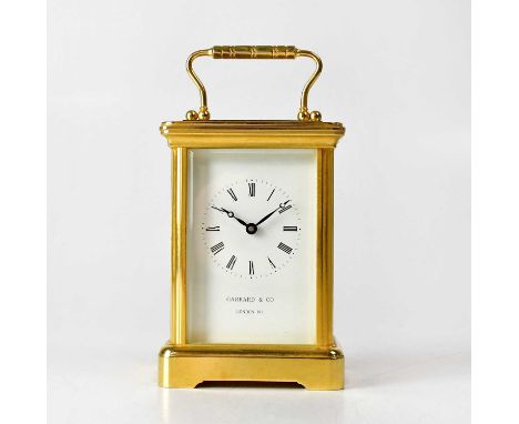 GARRARD &amp; CO; a brass cased carriage clock, the named enamelled dial set with Roman numerals, the single drum movement st