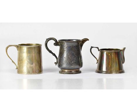 A Victorian hallmarked silver footed jug with engraved floral decoration and initialled 'DGH', height to top of handle 8.2cm,