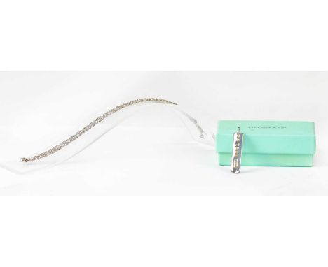 TIFFANY &amp; CO; a 925 silver bar pendant, inscribed '925 T &amp; CO 1837' to one side and dated 2001 to the other side, len