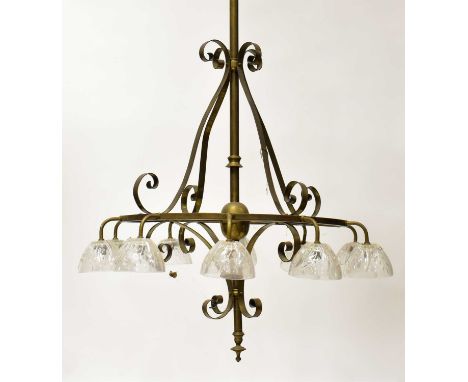 A large brass light fitting, with long drop column and supporting ring, diameter 60cm, mounted with ten downlights fitted wit