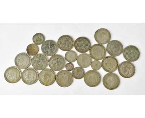 A group of silver coinage to include an 1898 threepence and a group of half-silver comprising half-crowns, florins and sixpen