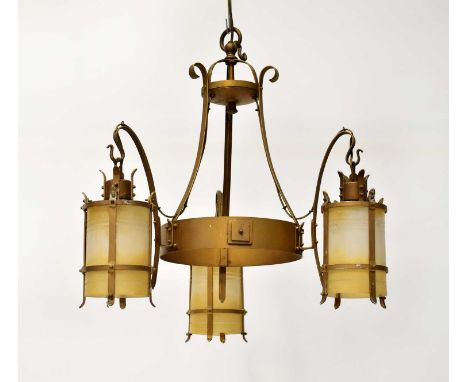 A gold painted three-branch electrolier, with three frosted cylindrical storm lantern style shades, height approx. 65cm.Pleas