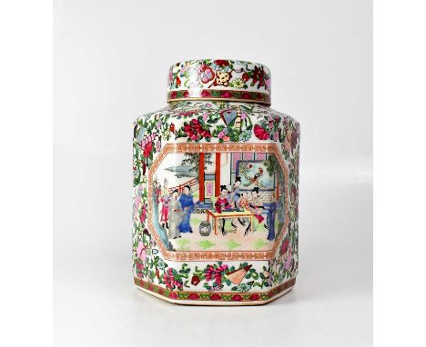 A Canton hexagonal lidded ceramic tea caddy, with two vignettes panels of figures in courtyard scenes, with iron red six-char