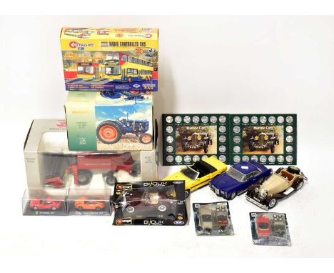 Various diecast and plastic model vehicles including a boxed Massey Fergusson Tractor, a boxed Fordson Major E27N Tractor, a 