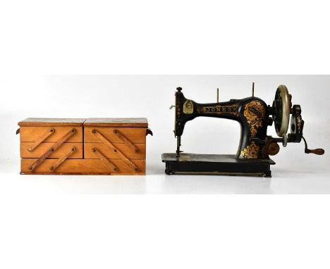 A Jones' Family CS manual sewing machine, numbered 413110, together with a wooden concertina three-tier sewing box and conten