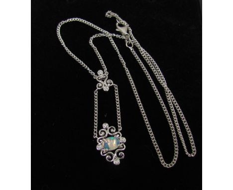 An opal and zircon pendant hung on chain, both stamped 925