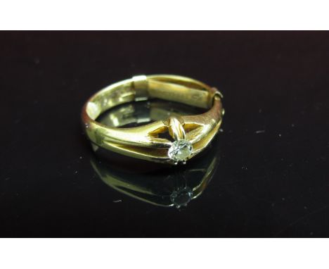 An 18ct gold gent's ring set with single diamond in open mount. Size R, 5.6g 