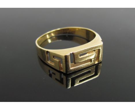 A gold ring stamped 18ct. Size Q, 3.4g