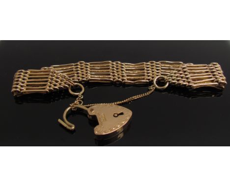 A 9ct gold seven bar gate bracelet with engraved padlock clasp, 23.6g      