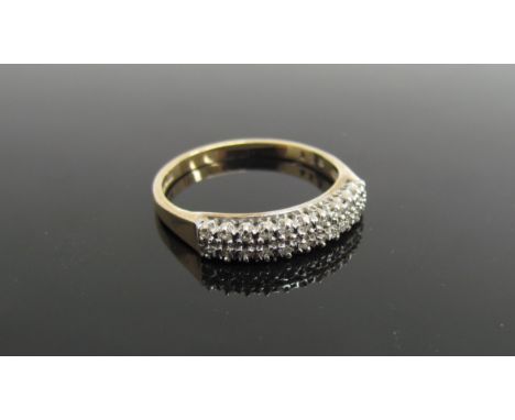A 9ct gold two row diamond chip ring. Size M, 1.7g