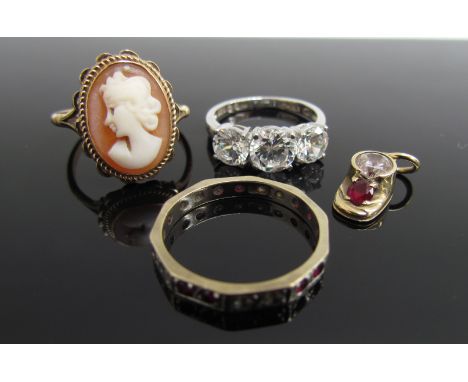 A 9ct gold cameo ring. Size Q, 2.8g, a ruby and white sapphire eternity ring. Size N, 1.9g a costume ring and a gold ruby and